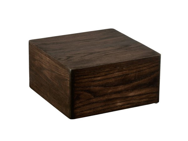 A dark brown Cal-Mil wooden block with a smooth finish and visible wood grain. This Heritage Riser is rectangular and solid, shown at an angle against a plain white background.