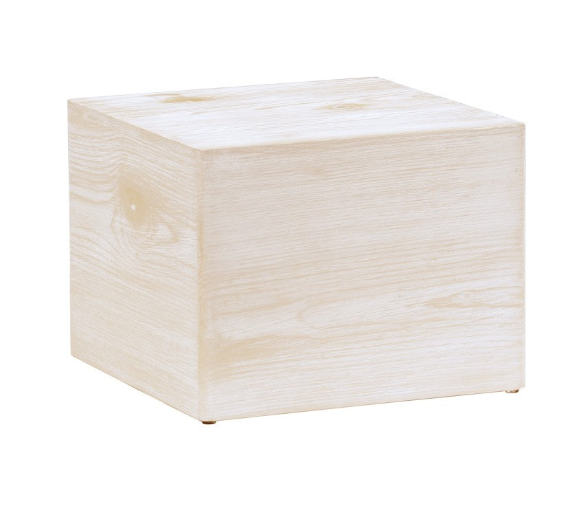 A light-colored white-washed pine wood cube sits on a white background. With smooth, natural grain and slightly rounded edges, this Newport-inspired riser brings a minimalist and modern touch to any setting.