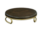 A round, dark stained oak top forms the surface of this Heritage Riser, elevated by three short matte gold wire base legs that curve outward in a decorative loop design for a simple, modern look.