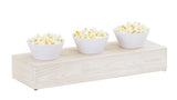 Three white bowls filled with popcorn sit in a row on a Newport white-washed pine wood riser against a white background. The bowls are evenly spaced, showcasing the platform's subtle wood grain.