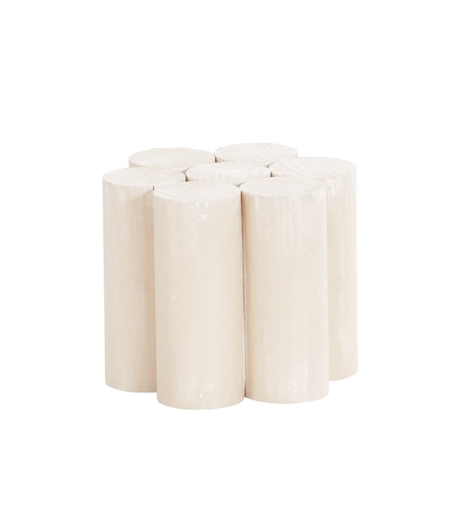 A stool made of eight cylindrical, glossy, light beige, white-washed pine wood logs arranged vertically in a tight cluster, forming a flower-like shape with smooth, rounded tops and sides, set against a white background. Newport Pedestal Riser Base inspired.