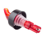 A red and black plastic Proper Pour bottle pour spout with a tapered spout, ribbed silicone stopper, and clear chamber for controlling liquid flow, photographed on a white background.