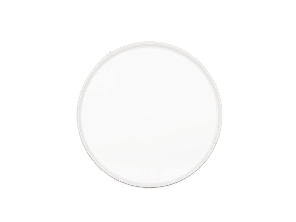 A plain, round white ceramic plate is centered on a white background. The plate’s smooth surface and simple design create a minimalist appearance, similar to the classic look of the Hudson Bowl, with no visible patterns or decorations.