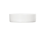A simple, round Hudson Bowl with straight sides is centered on a plain white background. This minimalistic, white ceramic bowl has no visible decorations or handles and is dishwasher safe for easy cleaning.
