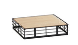 A rectangular riser tray with a light wood base and black Madison metal grid frame, placed on a white background. The design blends industrial and natural elements for a modern, minimalist look.