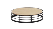 The Madison round coffee table features a light wooden top and a black metal base with three horizontal circular bars, creating an open, airy design. Its reversible design adds versatility, making it both stylish and functional against any white backdrop.