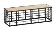 A rectangular bench with a metal black grid frame and flat wooden top features a reversible design. The industrial style, open sides, and minimalist look make it sturdy and practical for seating or storage in modern interiors.
