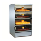 A stainless steel cheese pre-warmer cabinet holds four transparent bags of sauce, each with a yellow cap. The bags are stacked on heated shelves; the top three sauces are yellow-orange, while the bottom bag contains red chili sauce. The door is partially open.