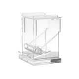 A transparent acrylic desktop tape dispenser with a slanted design, featuring a roll holder and a serrated edge for cutting tape. Its clean, smooth edges and modern, minimalist look make it easy to pair with any acrylic toothpick dispenser.