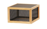 A square wooden-framed Camden riser features black perforated metal mesh sides and a solid black top and bottom. Displayed on a white background, its modern, minimalist aesthetic shines with a geometric, reversible design.