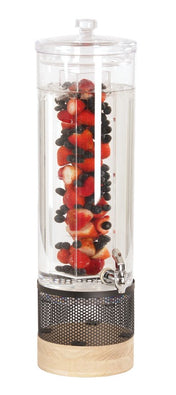 A clear 3 gallon beverage dispenser filled with water and a central infusion chamber packed with strawberries, blueberries, and blackberries sits on a wooden and black metal mesh base, featuring a metal spigot for easy dispensing.