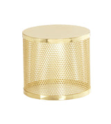 A shiny gold cylindrical metal riser table with a solid top and bottom. Inspired by Monaco style, its sides feature a perforated mesh design with evenly spaced round holes, adding a modern, airy look. The entire table boasts a polished finish.