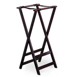 A dark brown wooden luggage rack with a mahogany finish and crossed legs forming an X shape. Two horizontal bars at the bottom connect the legs, while four black straps across the top provide support. Rubber slip-proof feet keep the rack steady as it stands open and empty.
