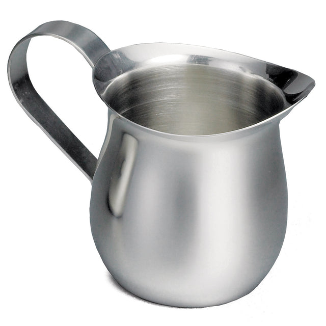 A 3 oz stainless steel bell creamer with a wide spout, rounded body, and curved handle. The shiny, reflective surface stands out against the plain white background, highlighting its simple, functional design.