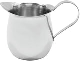 A shiny, stainless steel Bell Creamer milk jug with a rounded body, a spout for pouring, and a thin, curved handle. The highly reflective surface sits on a plain white background. This creamer is also dishwasher safe.