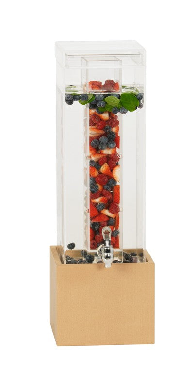A clear rectangular Renew Beverage Display with a wooden base made from upcycled rice hulls is filled with water. The central infusion chamber holds sliced strawberries, blueberries, and mint leaves, with a silver spigot on the front for easy pouring.