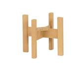 Wooden table base with four vertical rectangular legs and two intersecting horizontal support beams, forming an X shape at the center. Crafted from light-colored wood, this minimalist piece is perfect for a beverage display, photographed on a plain white background.