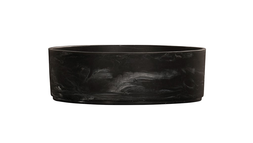 A sleek, round black marble bowl sink basin with subtle white veining. The vessel has smooth sides and a flat base, giving it a modern, minimalist appearance. The plain white background highlights the basin’s dark, elegant surface.