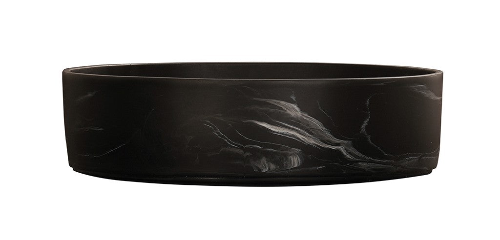 A round, shallow black marble bowl with a matte finish and subtle white marble-like streaks swirling across its resin exterior. The bowl sits on a white background, highlighting its smooth, contemporary design.