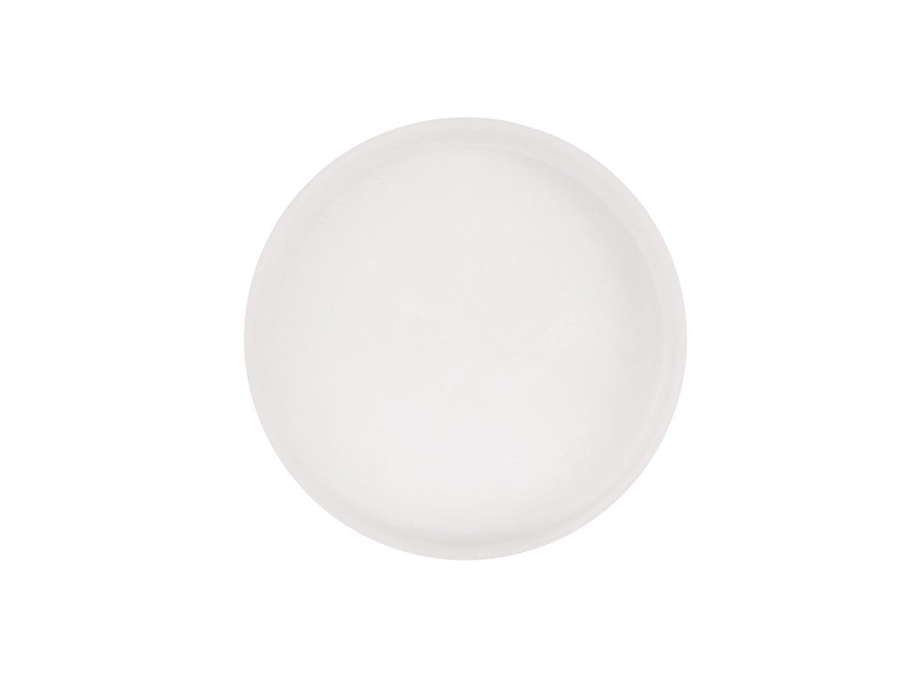 A plain, round, white ceramic plate is centered on a white background. The plate has a smooth surface that resembles white marble and features no visible patterns or decorations.