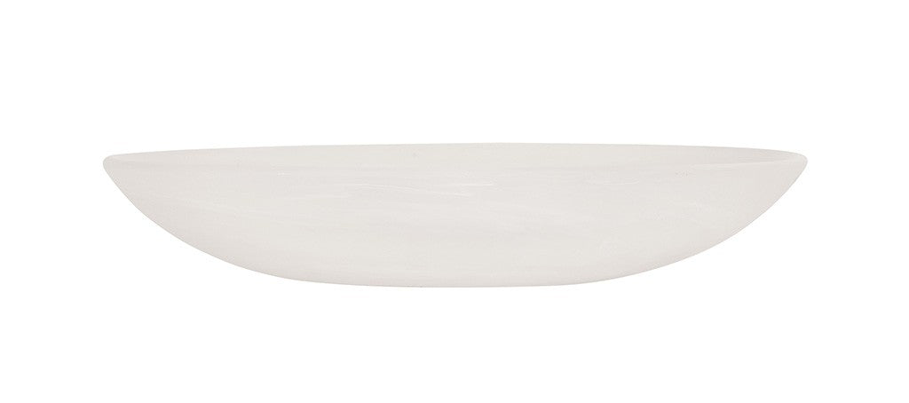 A shallow, oval-shaped white ceramic bowl is pictured in side profile against a plain white background. The bowl has smooth, gently curved sides and a glossy finish, resembling the elegance of a white marble bowl with no visible patterns or decorations.