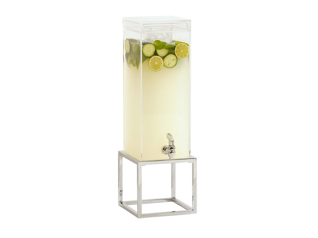 A tall, clear polycarbonate chamber ice beverage dispenser filled with pale yellow drink, topped with lime, cucumber slices, and mint leaves. The dispenser has a chrome plate finish spigot and sits on a modern, open silver metal stand.