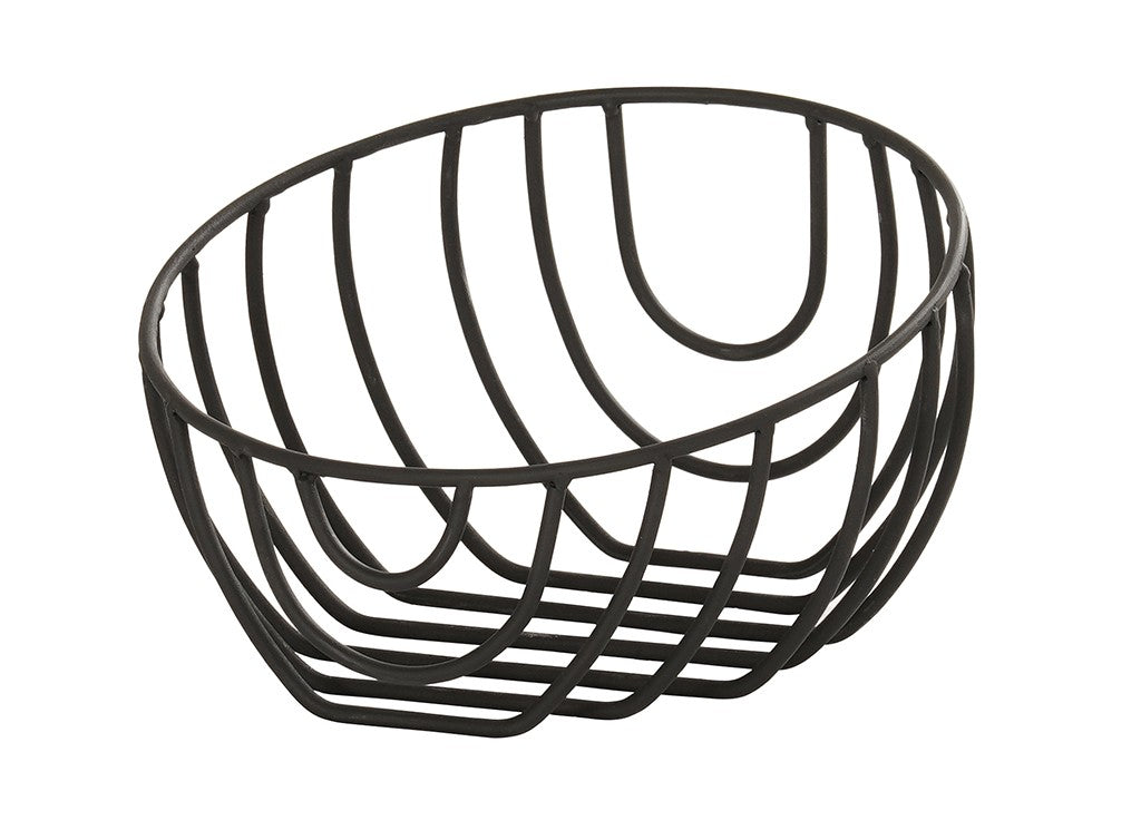 A black wire fruit bowl, like the Cal-Mil Madison Wire Basket, features an open, geometric design. This oval-shaped basket is made of curved metal rods for a modern, minimalist look against a plain white background.