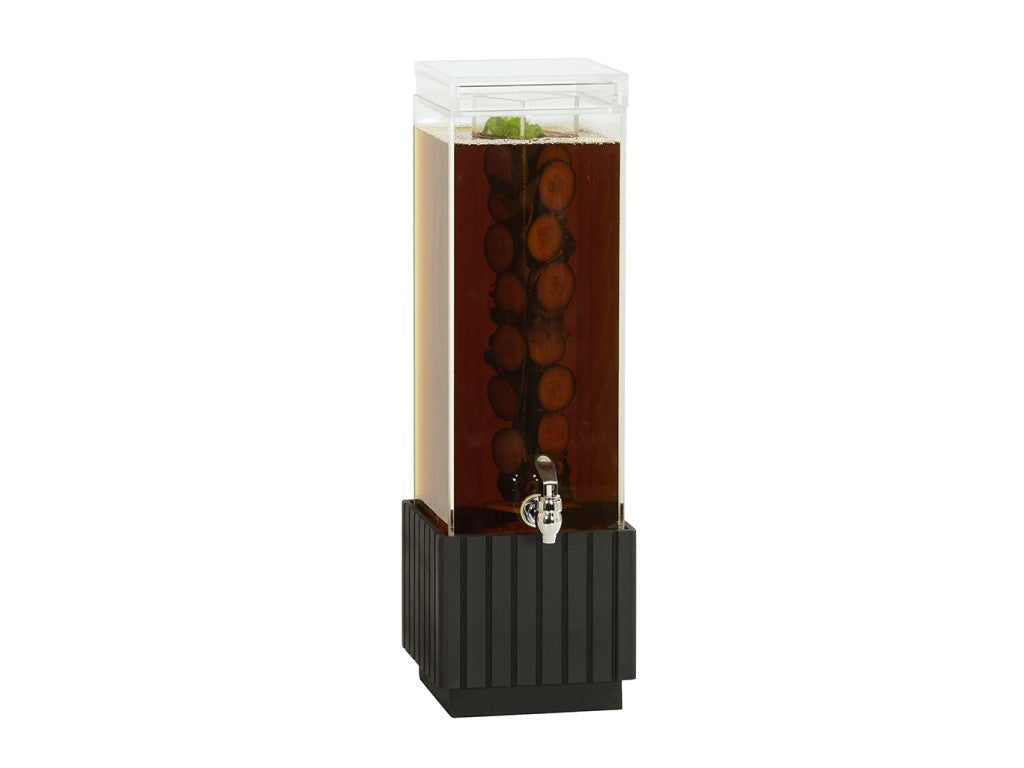 A tall, clear infusion beverage dispenser with a black base and spigot, filled with dark liquid and sliced fruits inside, topped with a transparent lid. The fruit slices are evenly stacked, with mint leaves floating on the surface.