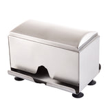 A stainless steel rectangular napkin holder with a curved top and an open front slot for dispensing napkins. The base has four black rubber feet for stability, and the sleek design with smooth edges is dishwasher safe for easy cleaning.