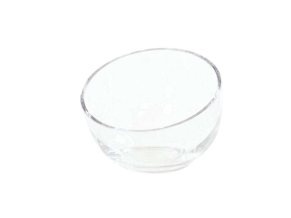 A clear, empty 6 inch bowl is shown against a plain white background. The simple, round Cal-Mil 23809-6-12 polycarbonate bowl is transparent, allowing light to reflect off its smooth surface and curved edges.