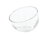 A clear, empty Cal-Mil bowl is positioned at an angle against a white background. This 7.5 inch bowl features smooth, curved edges and reflects light, highlighting its glossy surface and simple, modern design.