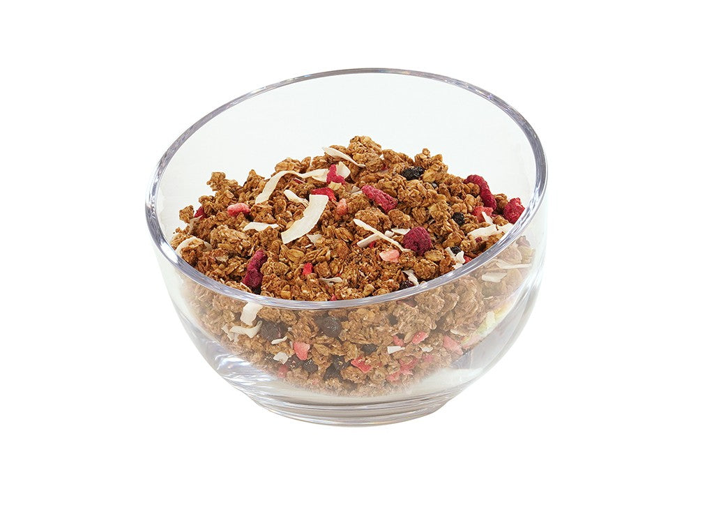 A clear 7.5 inch Cal-Mil bowl filled with granola, featuring clusters of oats, dried red berries, and white coconut flakes, placed against a plain white background.