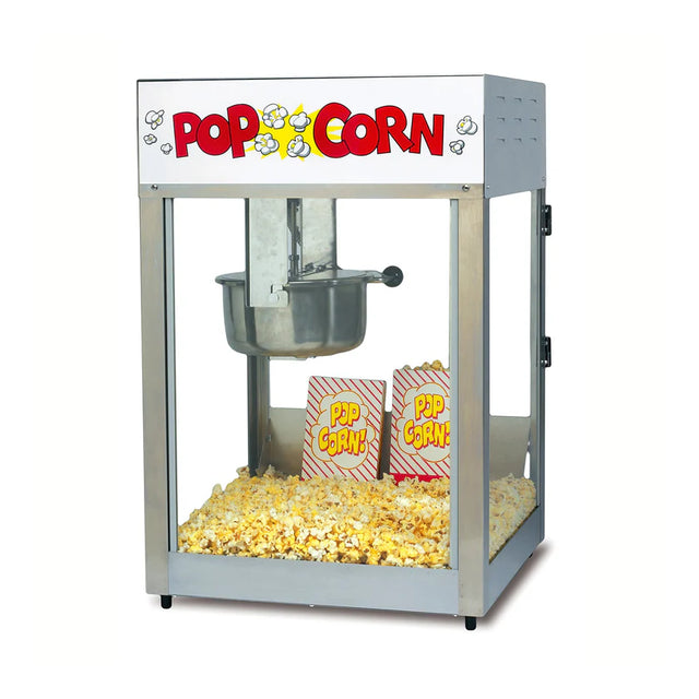 A classic Lil' Maxx Popcorn Machine with a glass case contains two striped red-and-yellow popcorn bags surrounded by freshly popped popcorn. The top of this electric popcorn machine displays a sign with the word Popcorn and popcorn illustrations.