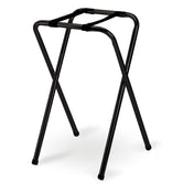 A black powder coated TableCraft tray stand with four tubular legs crossing in an X shape and a rectangular open top, designed to support trays or luggage. The sleek metal stand is set against a white background.
