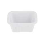 A small, empty, rectangular white melamine sauce cup with rounded edges and a wide rim, photographed against a plain white background.