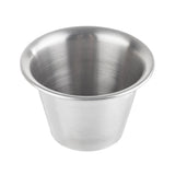 A 3 oz stainless steel sauce cup with a smooth, shiny surface and a rounded rim. The cup is empty and photographed against a plain white background, highlighting its simple, functional design.