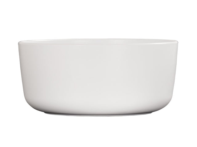 A plain white Oslo bowl with smooth, rounded edges and a matte finish. The bowl is empty and photographed against a white background, emphasizing its simple, minimalist design. This dishwasher safe bowl blends practicality with style.