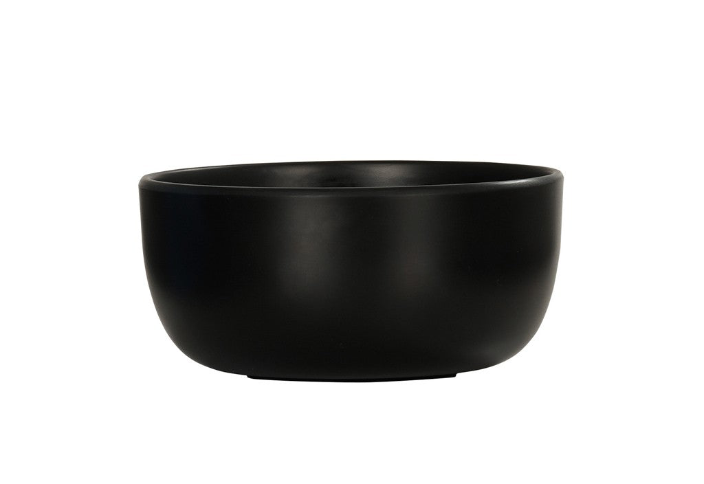 A matte black Oslo Bowl with smooth sides and a slightly thick rim, shown against a plain white background. This minimalist, modern ceramic bowl is dishwasher safe and perfect for everyday use.