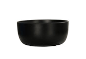 A matte black Oslo Bowl with smooth sides and a slightly thick rim, shown against a plain white background. This minimalist, modern ceramic bowl is dishwasher safe and perfect for everyday use.
