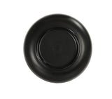 A black round melamine bowl, shown from below on a white background. The plate has a raised circular base with a faint maker’s mark in the center, though the text is not clearly legible. The Oslo Bowl is dishwasher safe with smooth, evenly curved edges.