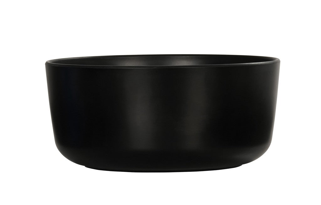 A matte black, round ceramic Oslo Bowl with smooth sides and a slightly curved rim, placed against a plain white background. Dishwasher safe, the bowl is empty and showcases a minimalist, modern design.