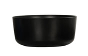 A matte black, round ceramic Oslo Bowl with smooth sides and a slightly curved rim, placed against a plain white background. Dishwasher safe, the bowl is empty and showcases a minimalist, modern design.