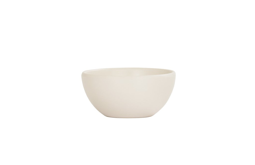 A plain, round, off-white Oslo Bowl is centered on a white background. The bowl has a smooth, matte finish and gently curved sides, with no visible patterns or decorations. This melamine bowl is also dishwasher safe for easy cleaning.