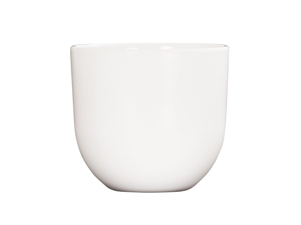 A simple, white, ceramic cup with a smooth, curved shape and a slightly rounded base, set against a plain white background. Inspired by Oslo minimalism, this cup is dishwasher safe and designed without a handle or visible decorations.