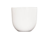 A simple, white, ceramic cup with a smooth, curved shape and a slightly rounded base, set against a plain white background. Inspired by Oslo minimalism, this cup is dishwasher safe and designed without a handle or visible decorations.