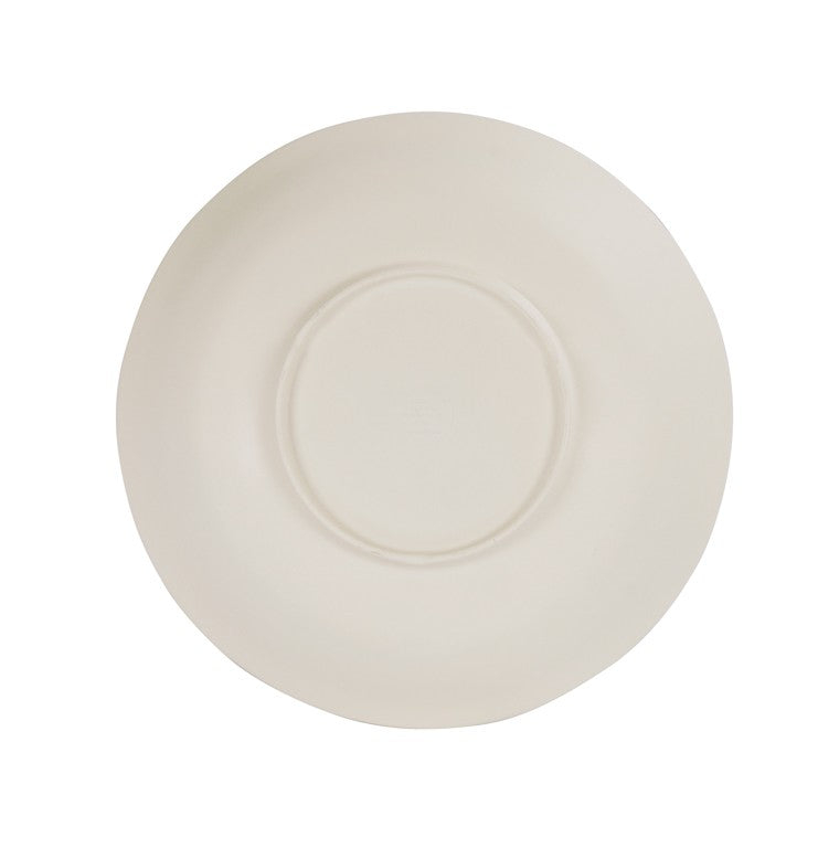 A plain, off-white ceramic plate viewed from above. The plate has a slightly uneven, handcrafted edge and a circular indentation in the center, resembling a hand thrown bowl, set against a white background.