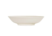 A plain, white, shallow Hand Thrown Bowl with a slightly irregular, organic-shaped rim. Photographed from the side against a white background, it highlights the bowl’s minimalistic and modern design. Dishwasher safe for easy cleaning.