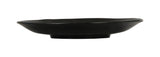 A matte black, round ceramic plate with a slightly irregular, wavy rim and flat central surface. Viewed from the side, this Hand Thrown Bowl features a shallow depth and slightly raised base. The background is plain white.