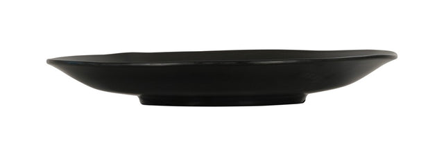 A matte black, round ceramic plate with a slightly irregular, wavy rim and flat central surface. Viewed from the side, this Hand Thrown Bowl features a shallow depth and slightly raised base. The background is plain white.
