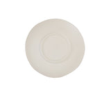 A plain, white ceramic plate lies upside down against a white background. The plate has a slightly irregular, organic shape, reminiscent of a hand thrown bowl. Subtle embossed text is visible on the underside but is not clearly readable.